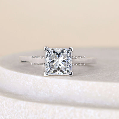 Princess engagement ring in yellow gold cathedral setting