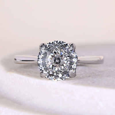 Round diamond solitaire engagement ring with claw prong setting