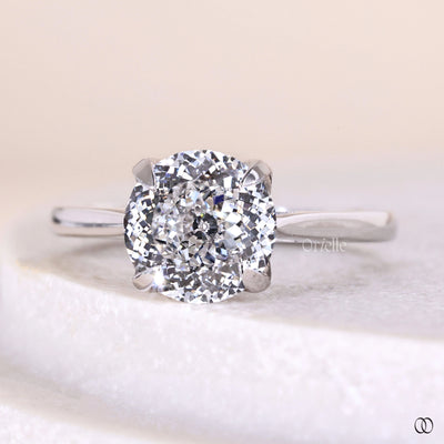 Handmade round diamond solitaire ring with cathedral setting