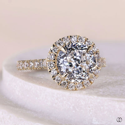 Handmade round diamond solitaire engagement ring with cathedral setting