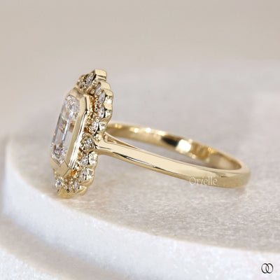 Yellow gold engagement ring with emerald cut lab grown diamond