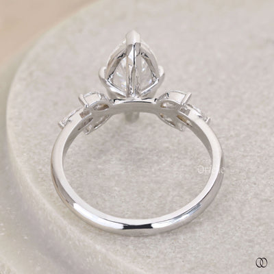 Marquise engagement ring with side stone detail