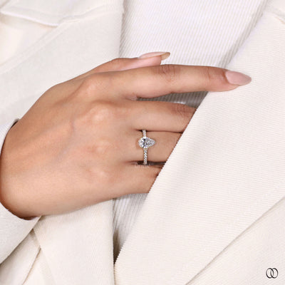 Yellow gold engagement ring with pear cut center