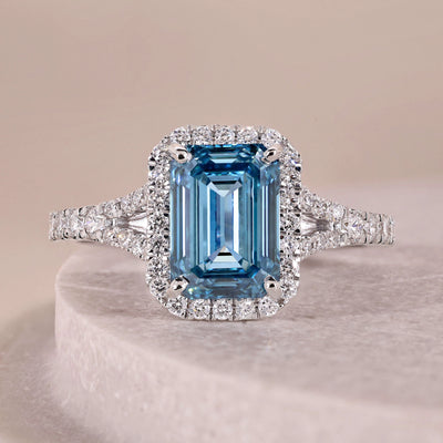 emerald cut diamond engagement ring blue halo
