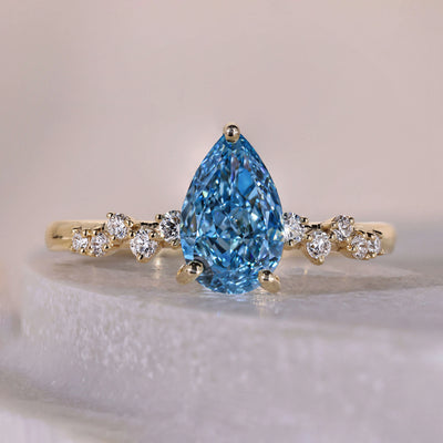 blue diamond engagement ring pear shaped design