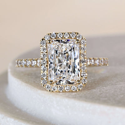 Radiant engagement ring with pave setting ring