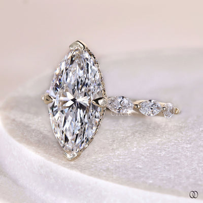 Handmade marquise diamond ring with claw prong and hidden halo setting