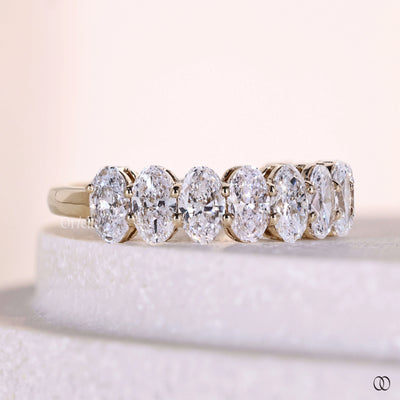 prong set diamond band yellow gold style