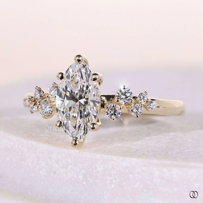 Handmade marquise cut diamond ring with side stone accents