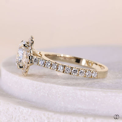 Unique round diamond engagement ring with halo setting in yellow gold