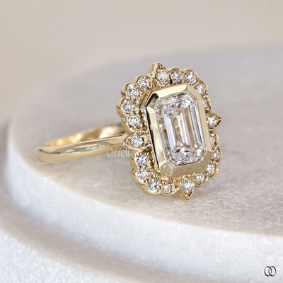 Halo diamond engagement ring with emerald cut center diamond