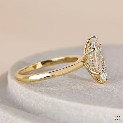Yellow gold engagement ring with marquise diamond centerpiece