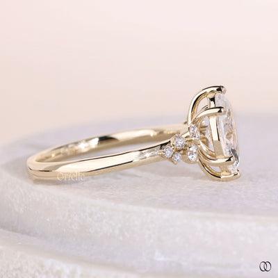 Marquise cut engagement ring with prong setting and gold band