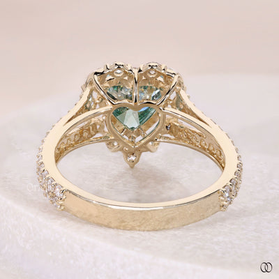 Yellow gold heart shaped diamond ring with split shank halo band