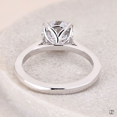 Round solitaire diamond ring with cathedral setting in white gold