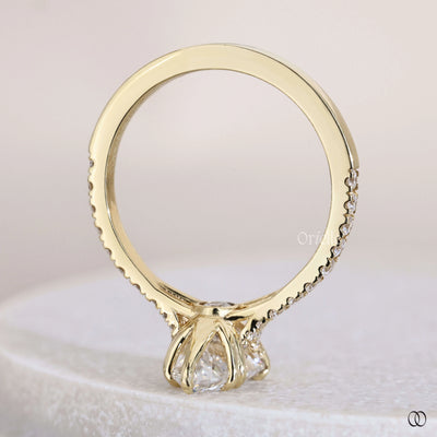 Peek a boo ring detail under pear cut setting