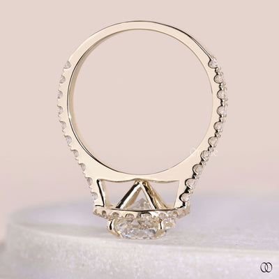 Lab grown round diamond solitaire ring with halo engagement design