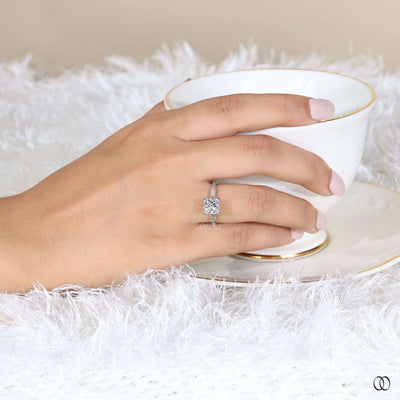 Yellow gold engagement ring with princess diamond centerpiece