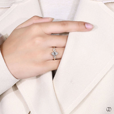 Unique marquise ring with side stones and yellow gold setting