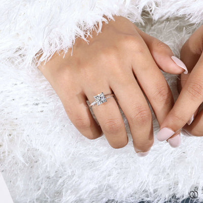 Side stone diamond ring enhancing princess engagement ring