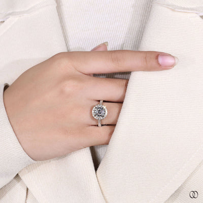 Round diamond solitaire engagement ring with cathedral gold setting