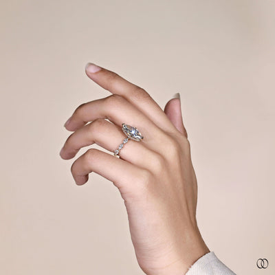 Yellow gold marquise diamond ring with hidden halo and claw prongs
