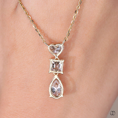 modern heart pendant with three lab grown diamonds