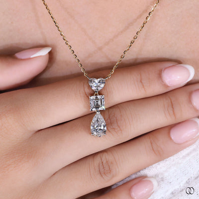 three diamond heart pendant in yellow gold setting