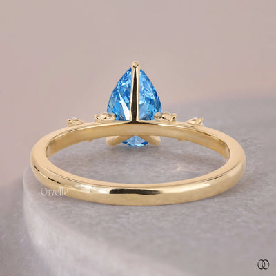 side stone engagement ring pear diamond ring