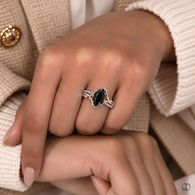 round side stone marquise engagement ring