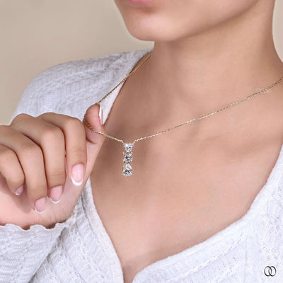 designer heart pendant with princess and pear diamonds