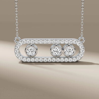 Handmade three diamond pendant in bezel and halo design