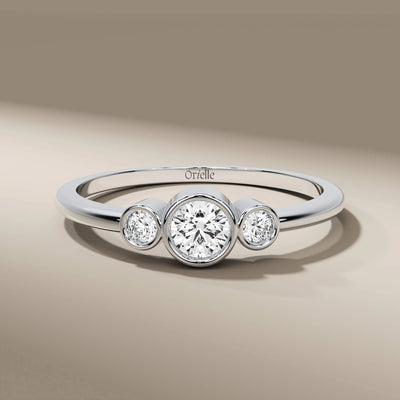 unique design yellow gold band featuring three stones