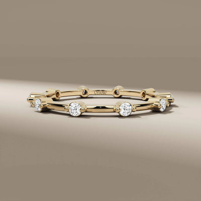 distance pave wedding band with full eternity round diamonds