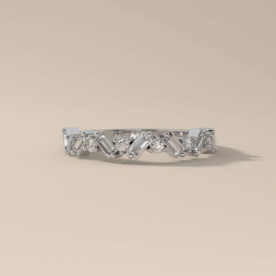 Half eternity yellow gold band featuring baguette cut stones