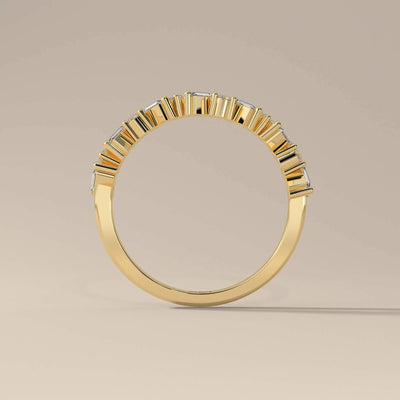 Handmade yellow gold band with round and baguette moissanite