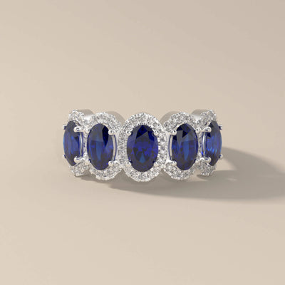 Unique design wedding band with five oval sapphires in gold
