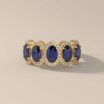 Blue sapphire halo band crafted in yellow gold by hand