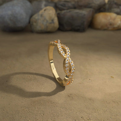 unique infinity twisted wedding band with round moissanite
