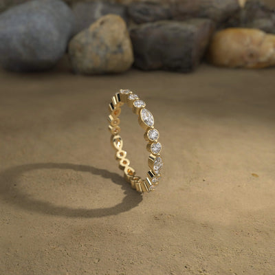 Bezel set marquise cut band crafted as a unique designer wedding band
