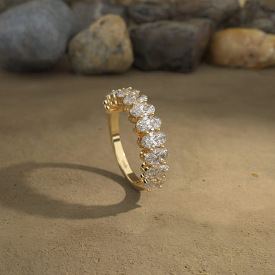 Yellow gold half eternity band with oval moissanite sparkle
