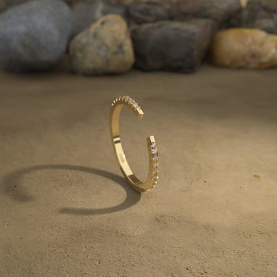 handcrafted yellow gold band with round cut prong setting
