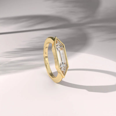 Unique design three stone ring crafted in yellow gold
