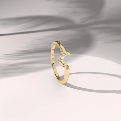 Yellow gold round cut band with a clean prong setting

