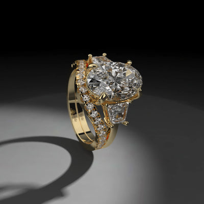 oval engagement ring with round diamond band in shared prong style
