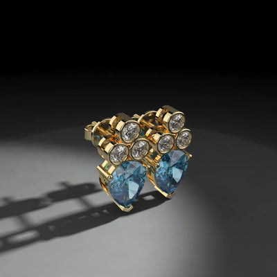 Designer sapphire earrings with prong set round moissanite accent
