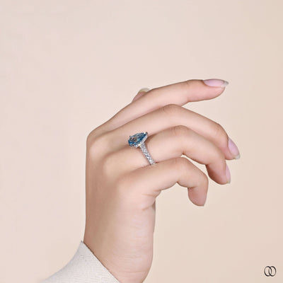 White gold pear shaped diamond ring with unique handmade setting

