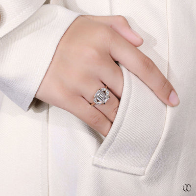 claw prong ring hidden halo emerald diamond
