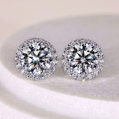 round diamond halo stud earrings in white gold setting
