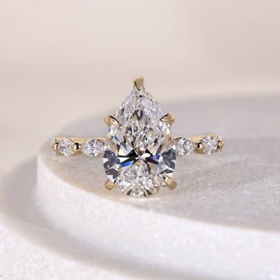 hidden halo engagement ring pear cut diamond ring
